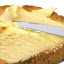 A knife buttering bread.