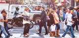 People on their way to work walking on a zebra crossing meet our Expancel Microspheres product in everything from the leather jacket and shoes they are wearing to paint on buildings and in seats, dashboards and underbody coatings in cars. 